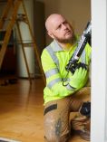 Contractor working on house.