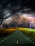 Road with storm in the distance.