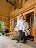 Couple on Porch of Log Cabin