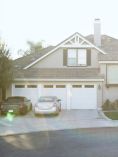 House with two cars in driveway