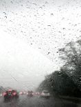 POV of driver driving in the rain.