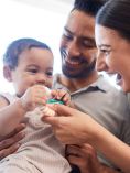 Parents playing with baby.