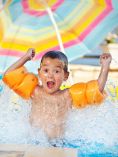 Kid splashing in pool