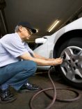 Man Inflating Tires