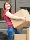 young girl holding moving boxes