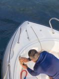 Man washing boat