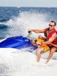 Man and child on personal watercraft