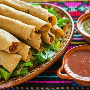 Photo of chicken taco rollups and salsa on the side