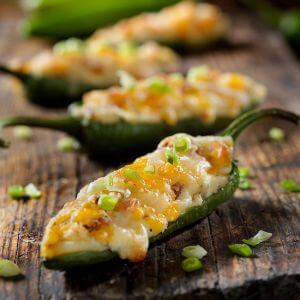 Photo of stuffed jalapenos with cheese on top