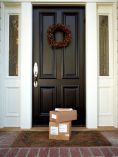 Pretty front door with packages in front.