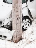 Car Hit Pole in Snow
