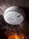 smoke alarm with smoke around it