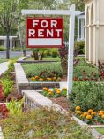 For Rent sign in front of house or apartment.